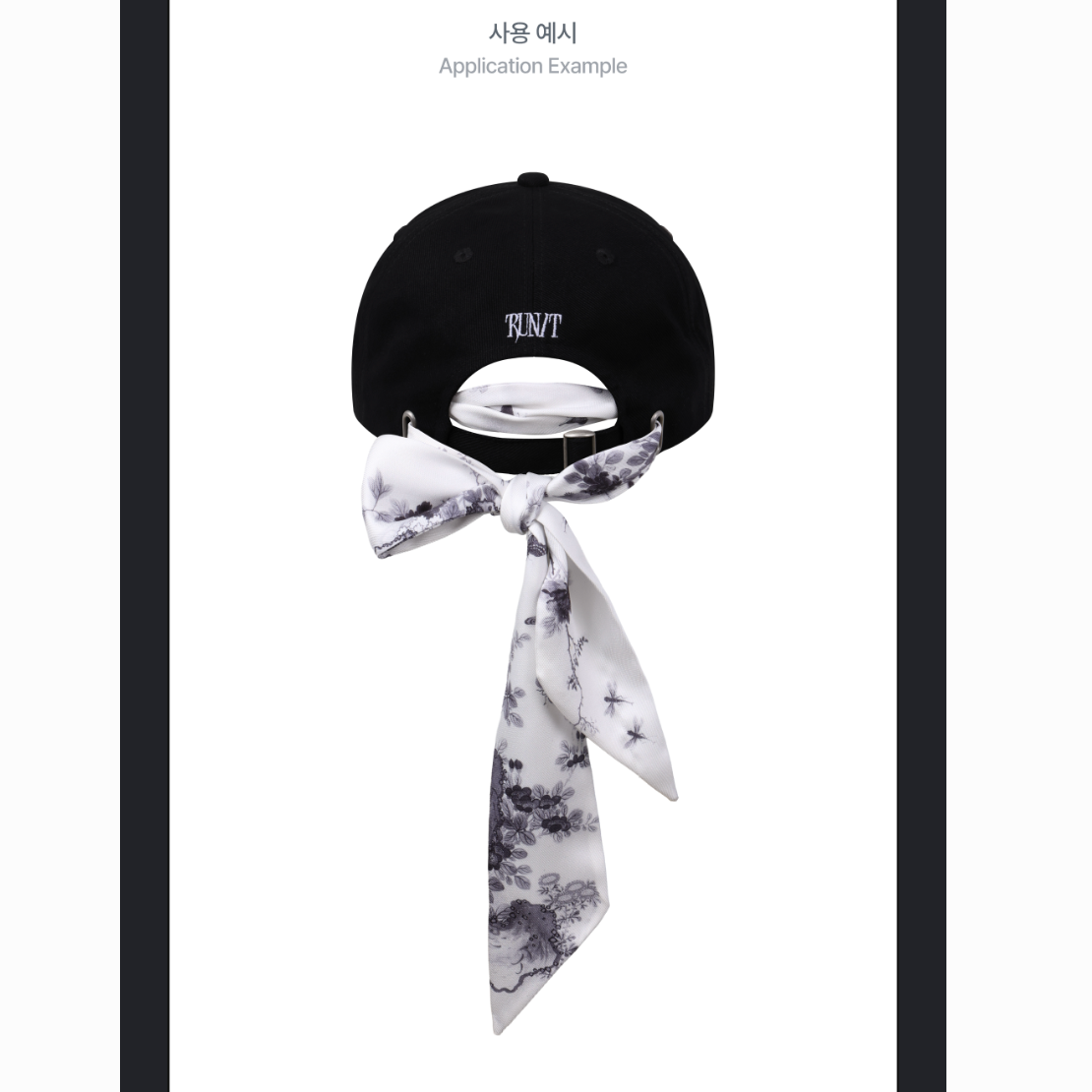 A black baseball cap shown from the back with a white neck scarf tied in a bow around the strap, on a white background with small text at the top reading 'Application Example'.