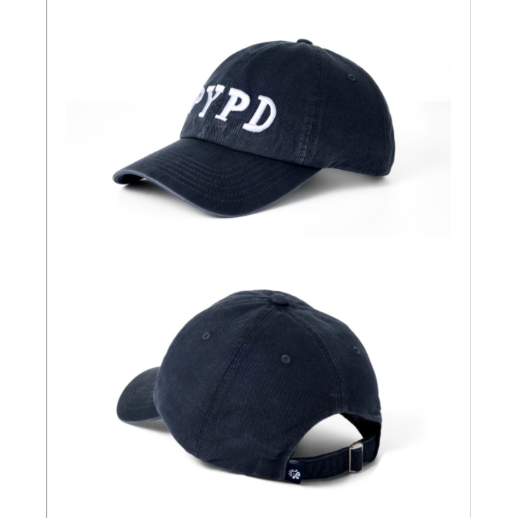 A dark navy blue baseball cap shown from two angles on a white background, with white embroidered 'PYPD' lettering on the front. Text below references CORTIS '26 TOUR 'PUT YOUR PHONE DOWN' official merchandise.